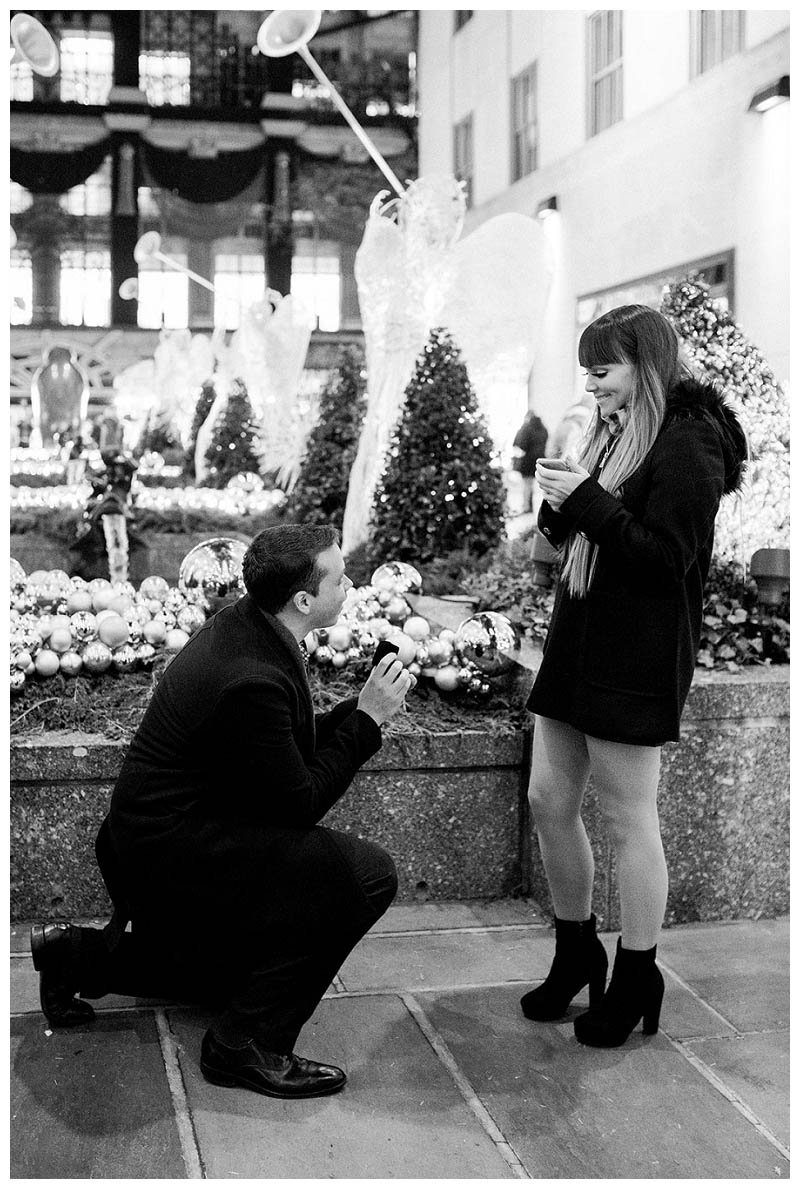 Best NYC proposal spot is Rockefeller Center during the holidays, captured by NYC wedding photographer Karina Mekel