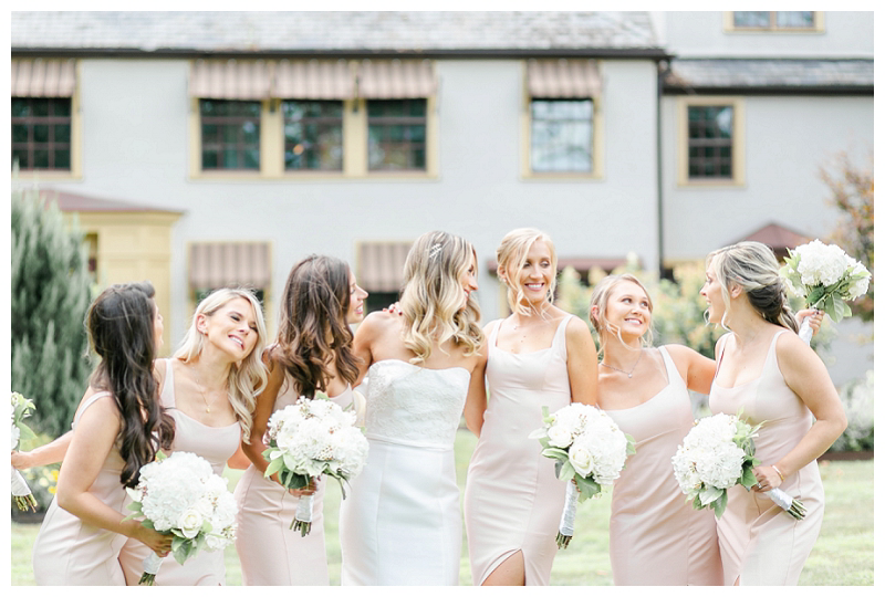 beautiful bride and bridesmaids in pink dresses at french estate wedding