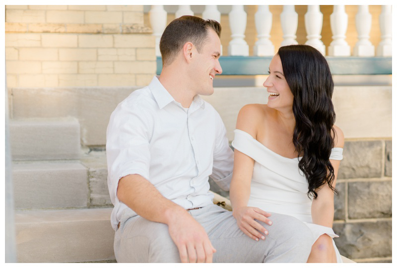 Fall engagement photos with bride in white off-the-shoulder dress.